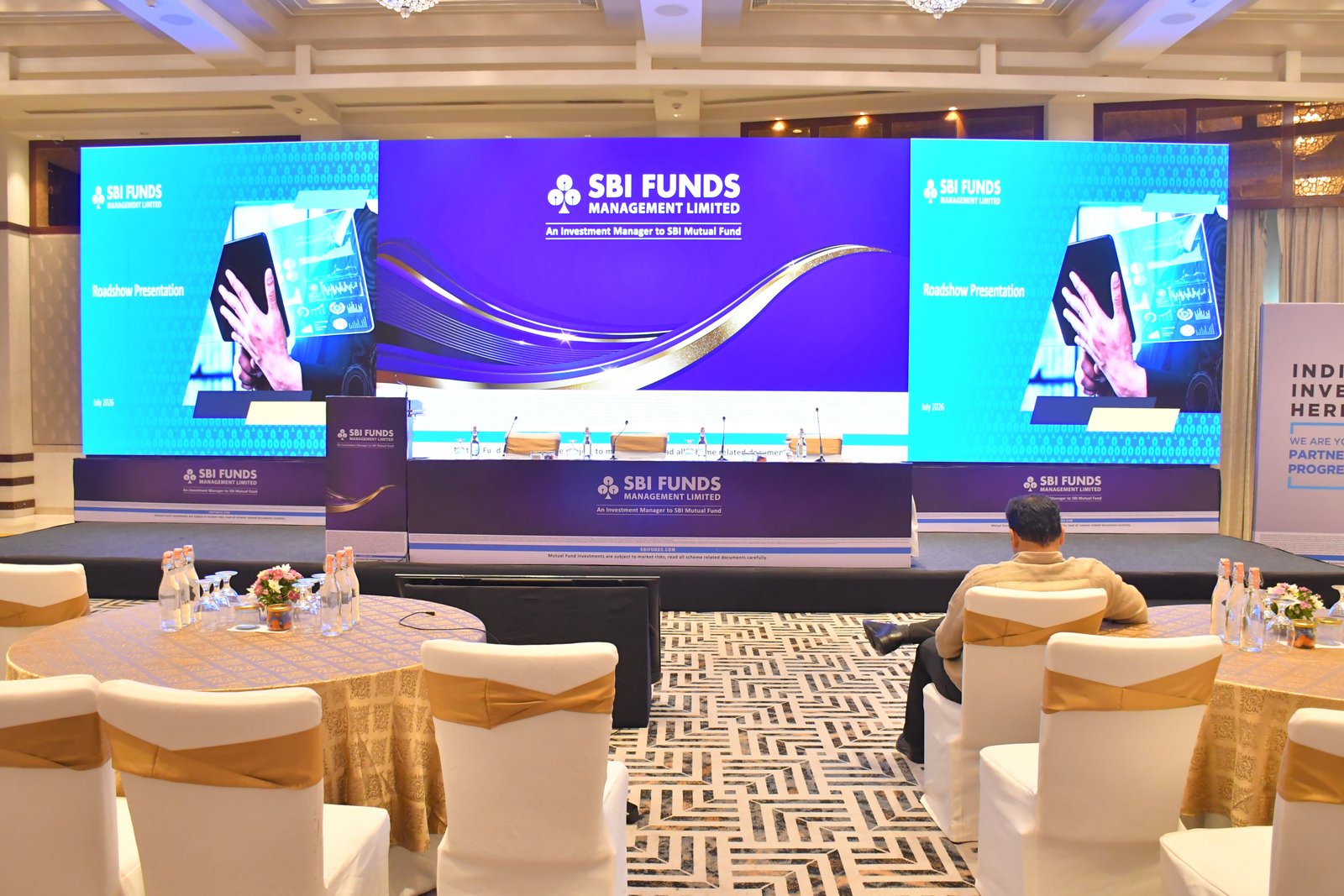 Investor and analyst meet in a hotel ballroom