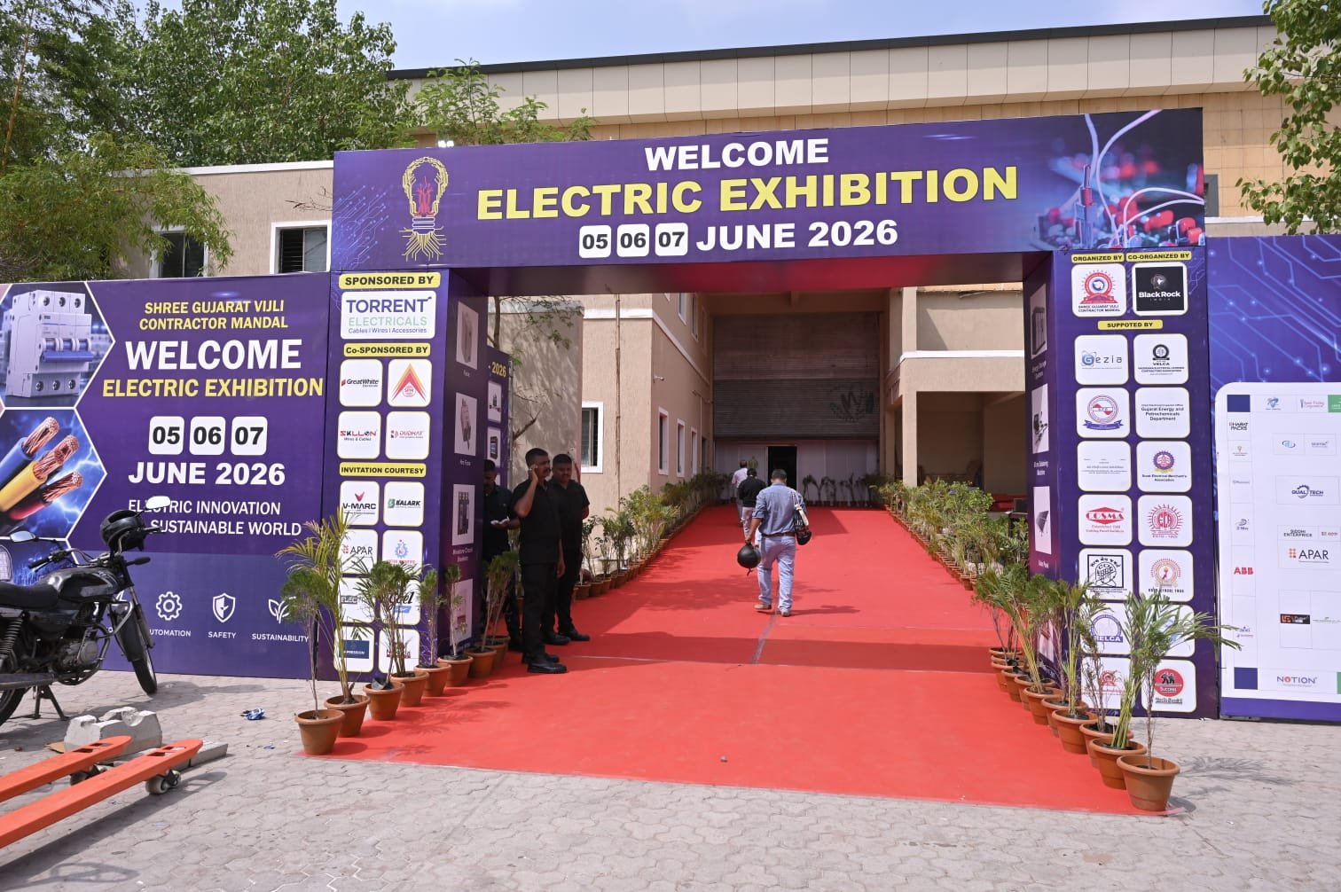 Exhibition hall in Ahmedabad with brand pavilions and visitors